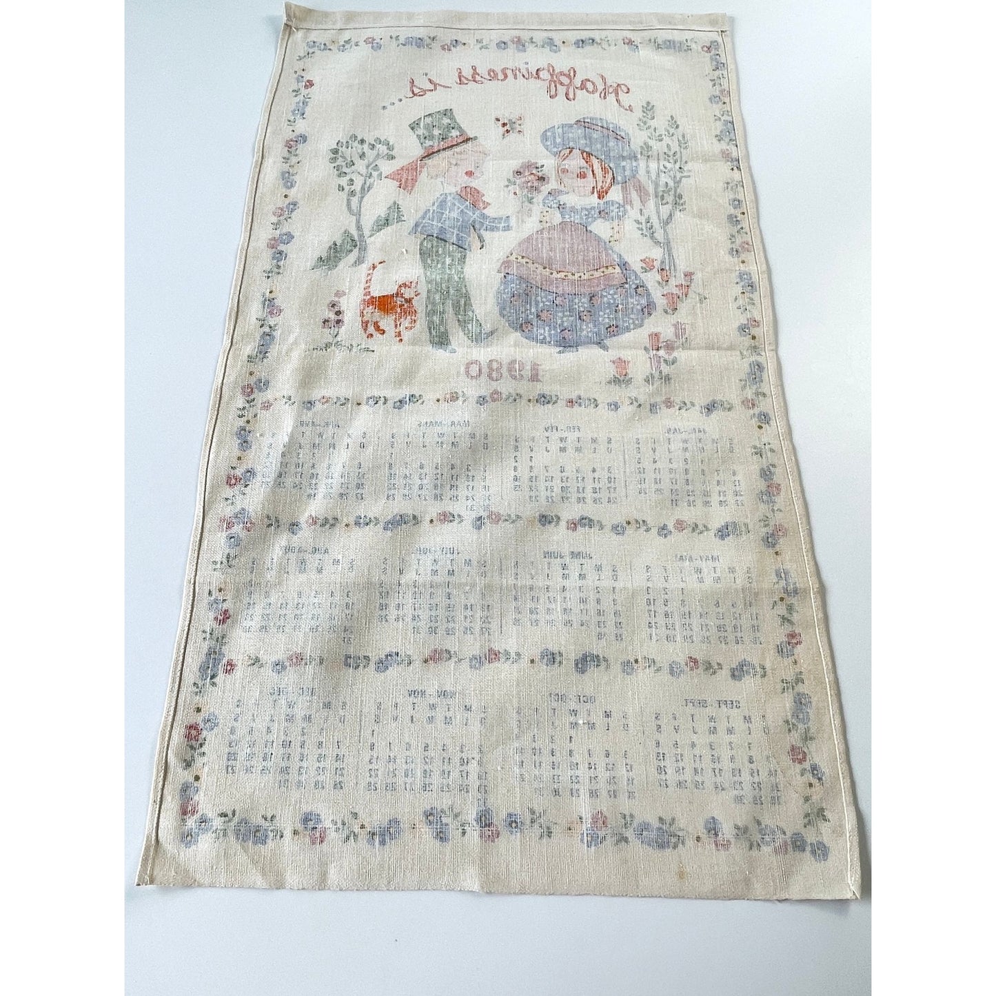 Vintage 1980 calendar tea towel, "Happiness is...", English/French