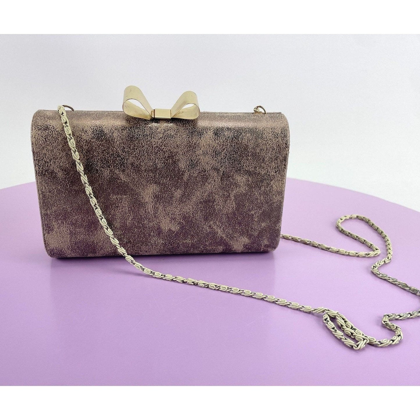 Vintage 80s hard shell clutch, gold tone, bow clasp