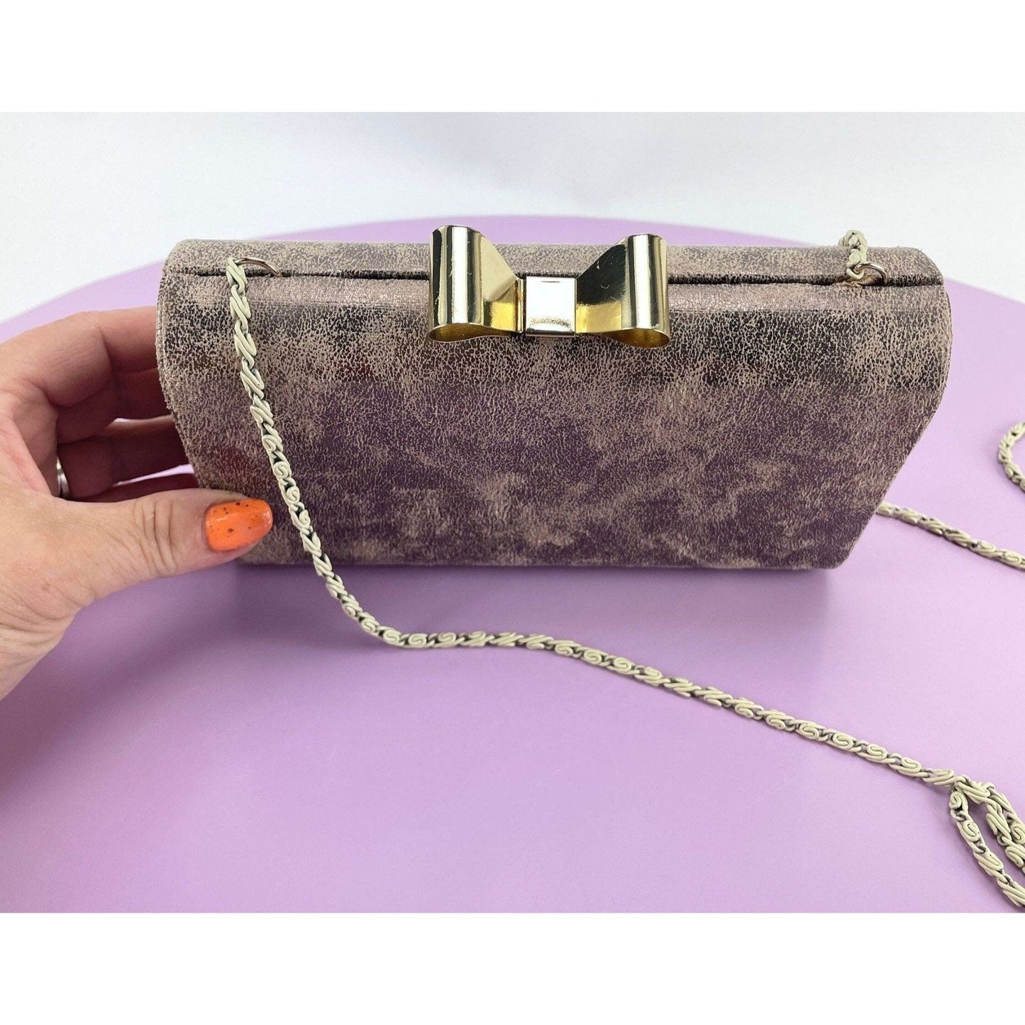 Vintage 80s hard shell clutch, gold tone, bow clasp
