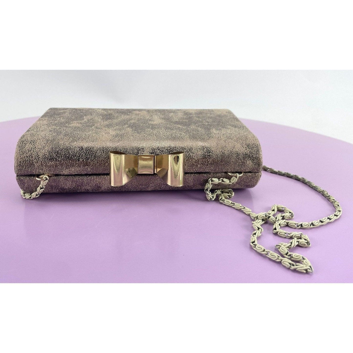 Vintage 80s hard shell clutch, gold tone, bow clasp